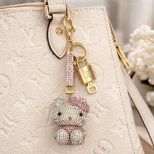 Authentic Louis Vuitton Gold Padlock & Key with Unbranded Hello Kitty Keychain